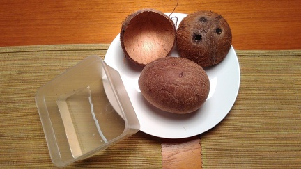 Full coconut and its water out of its shell