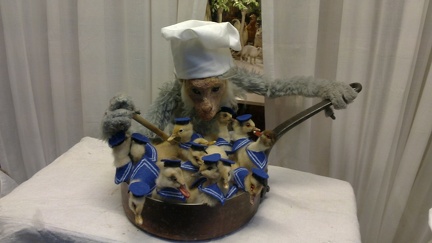 Monkey cooking ducklings (?)