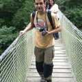 Crossing a wooden hanging bridge over Eume river