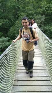 Crossing a wooden hanging bridge over Eume river